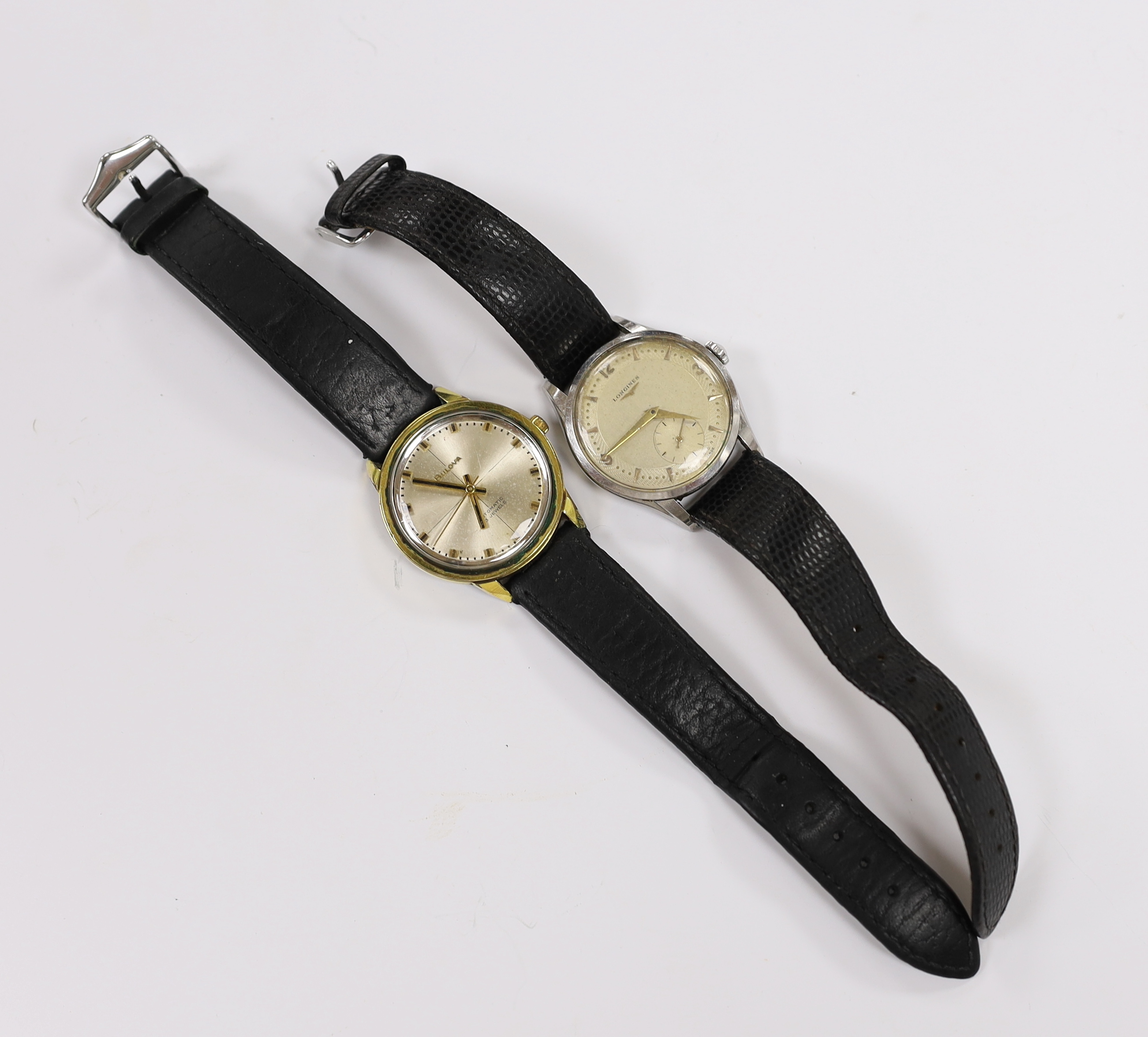 A gentleman's 1950's stainless steel Longines manual wind wrist watch, with case back inscription and a gentleman's steel and gold plated Bulova automatic wrist watch.